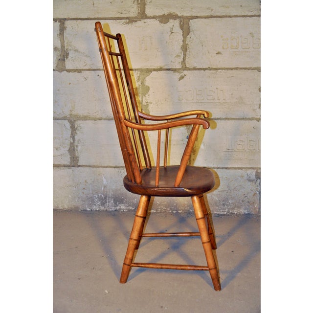 Here's a great looking and comfortable Windsor style chair my family purchased in the early 1970s. It came from a dealer...