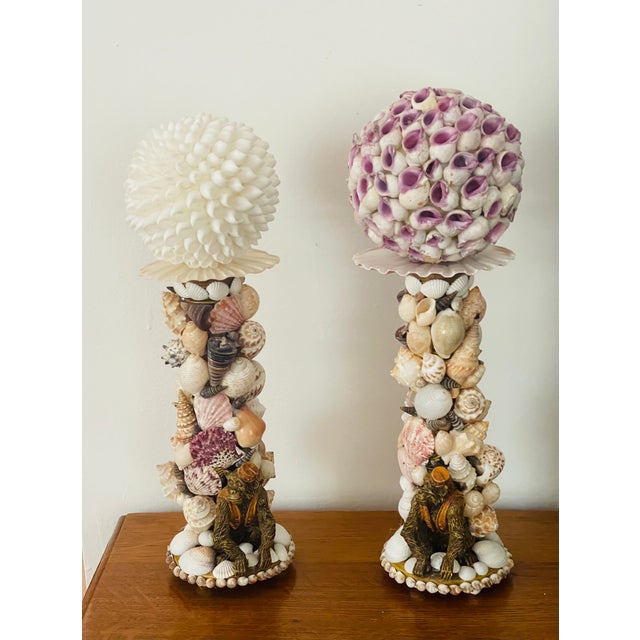 Whimsical Unique richly encrusted with sea shells pair of candlesticks with monkey figurines.Topped with sea shells orbs.