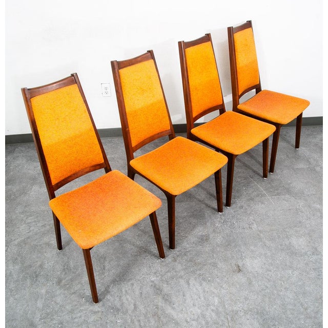 Set of eight Orange tweed and walnut dining room chairs w/ 2 matching captain chairs. American design. Unknown maker....