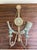 A beautifully detailed pair of Italian neoclassical wall sconces featuring a soft celadon green painted finish accented...