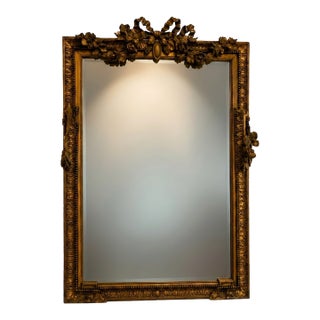 19th Century French Louis XVI Style Carved Giltwood Mirror With Floral Crest For Sale