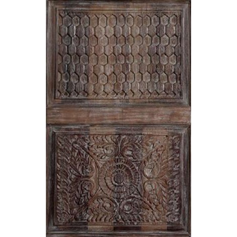 A beautifully preserved vintage wooden door featuring hand-carved floral motifs, showcasing the artistry and craftsmanship...