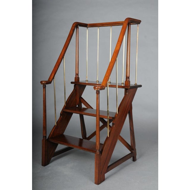 Unique English library ladder, mahogany, 20th century The ladder is crafted from solid mahogany and features brass...