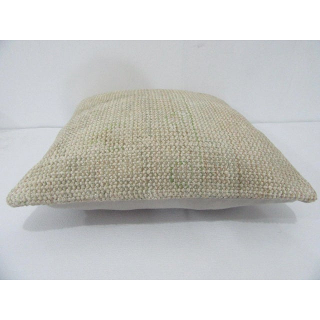 Decorative pillow cover made from a vintage Turkish handknotted rug. Backed with good quality cotton fabric. Pillow...