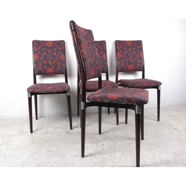 This unique set of high back dining chairs features a wonderful combination of stylish designer upholstery and unique...