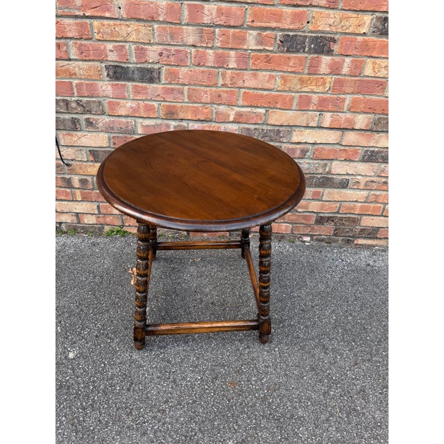 This is a wonderful 19th Century English round accent table featuring beautifully turned bobbin-style legs and sturdy...