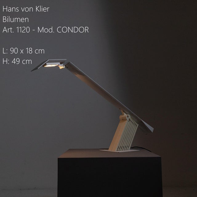 Bilumen Condor lamp, designed by Hans von Klier for Bilumen in the 1970s/1980s. The metal frame features beige and white...