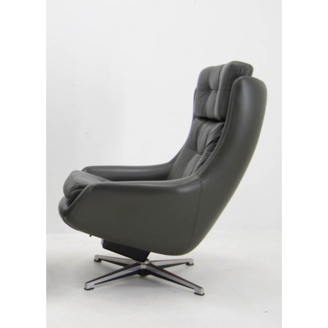 Elevate your interior with this striking Peem lounge chair—a true icon of mid-century modern design. Featuring a...