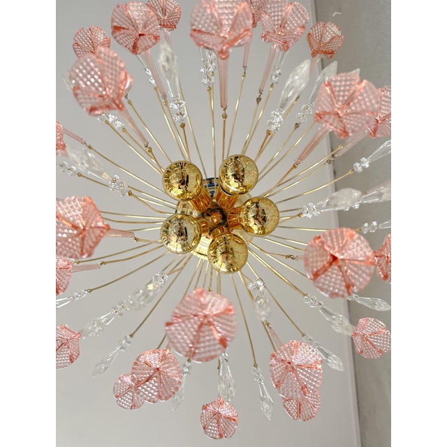 This vintage Italian pink floral chandelier adds a touch of elegance and charm to any room. Its delicate pink glass...