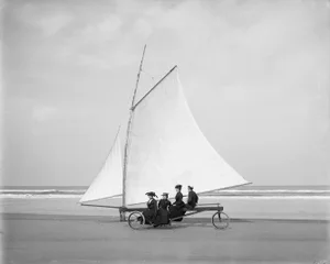 Vintage Sailboat With Women on Beach Photograph