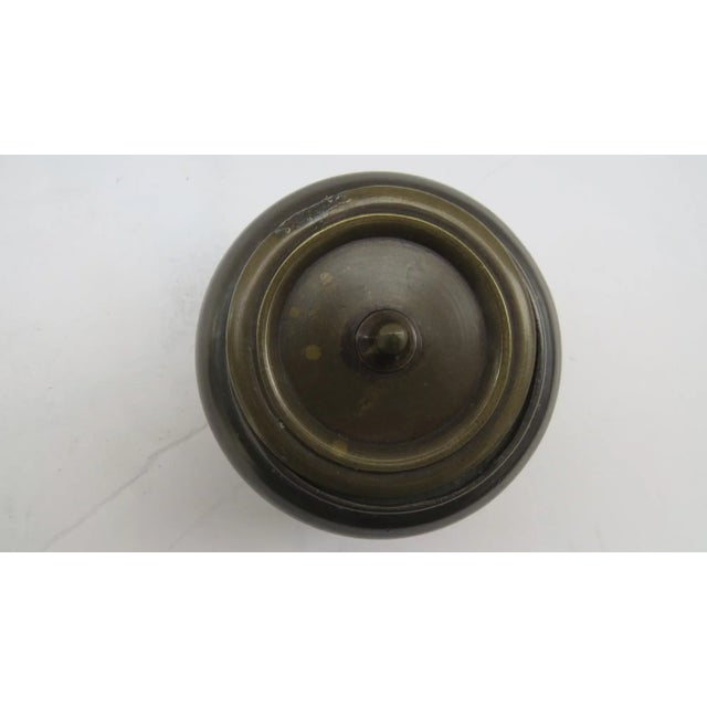 19th century or earlier pair of bronze Chinese pots. Measure 3 1/4" by 2 1/2" tall. Each has use marks. Sold old repairs....