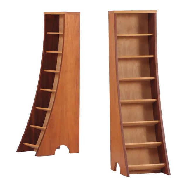 A Pair of Bench-Made Sculptural Walnut Bookcases Having Flared Bases For Sale