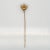 A very fine Late Victorian 10k gold & seed pearl stick pin. With a lotus shaped flower that has a small white round seed...