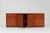 A sideboard in pressed bamboo, presumably made in Italy in the 1970s. The sideboard opens up to shelves on the left and in...