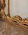Console table and mirror with decorated gilded wooden structure and marble top, Rococo style, early 1900s.