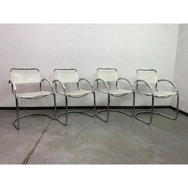 Tubular steel dining chairs attributed to Mart Stam in original vintage condition with signs of use.