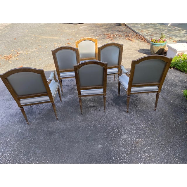Set of 6 Louis XVI dining chars, 4 side chairs and 2 arm chairs, upholstered in silver vinyl from Pollack. Hand painted...