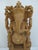 Hand-carved wooden statue of the Hindu deity Lord Ganesha, seated on a double lotus pedestal and attached to a raised...