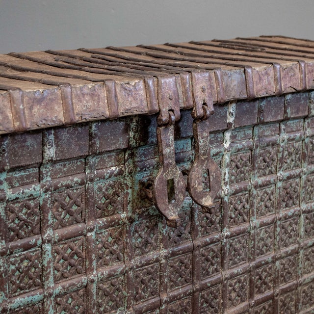 Antique Rajasthani storage chest "pitara chest", made of teak with metal strapping. The front is clad in a distressed...