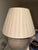 Gregorious Pineo Rondure Lamp. Dimensions are 13” diameter 28” H. The finish is Limestone. Shade included. Price is $1,800.