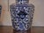 A pair of English blue and white porcelain lidded hexagonal pot pourri pots from the 19th century with dog finials....