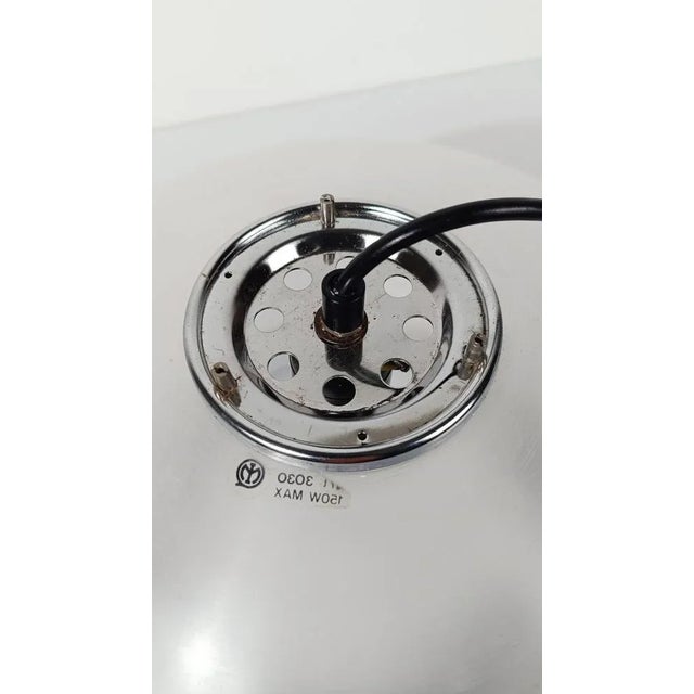 Iconic space age pendant lamp designed in 1968 by studio 6g, an internal design team of the manufacturing company, namely...