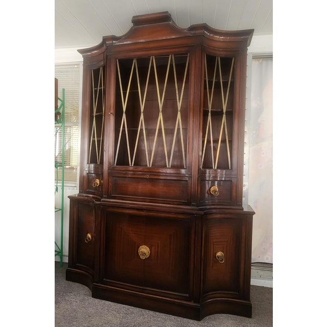 A grand statement china cabinet made by Grosfeld House, designed by Lorin Jackson, late 1930s, dark mahogany original...