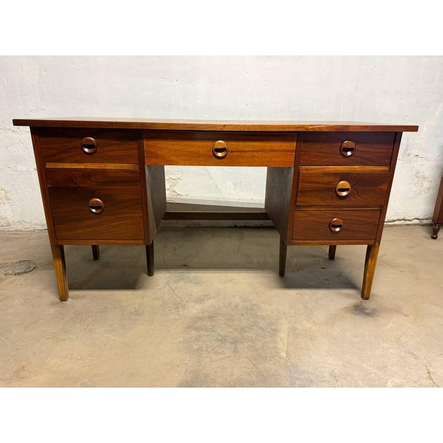 Mid Century Modern Walnut Freestanding Style Desk by Stanley furniture It features 3 drawers on each side, as well as a...