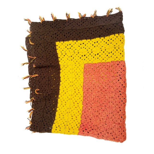 Cozy up in vintage charm with this handmade crochet blanket, featuring a bold block pattern in rich autumn tones of burnt...