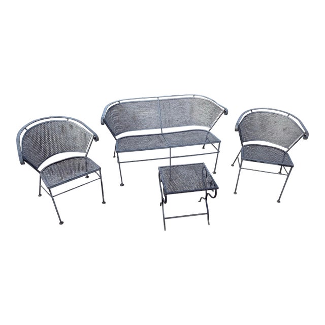 Vintage Wrought Iron Garden and Patio Furniture Four Piece Set Featuring Barrel Back Chairs and Bench With End Table For Sale