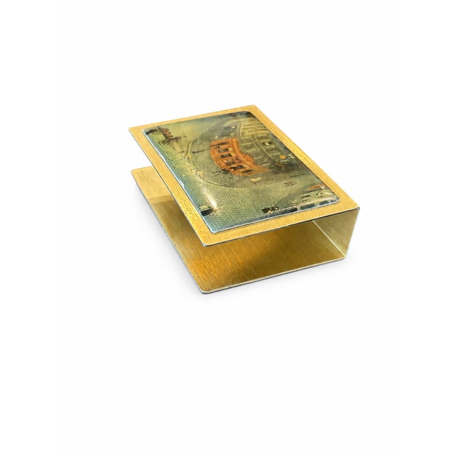 A sleek and substantial vintage brass matchbook holder engraved “PARIS” along the front edge. This minimalist accessory...