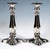 Two extraordinary festive Biedermeier silver candlesticks on a four-pass-shaped, flared, and domed base, with floral...