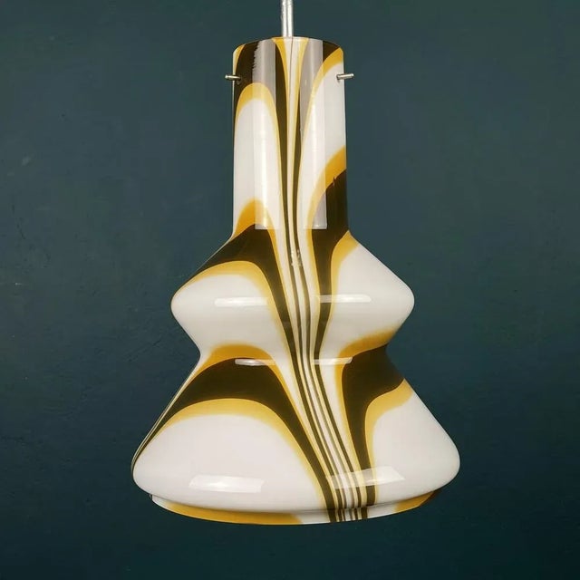 The mid-century refined 1950s italian design hanging lamp. The central structure of the lamp and the three pins, that...