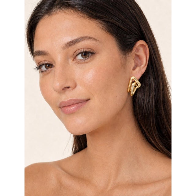 Italian earrings from circa 1980, crafted in 18K yellow gold with approximately 0.70 carat of round brilliant-cut...