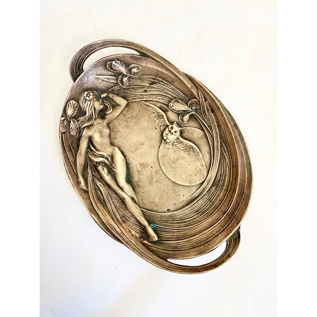 Lovely antique Art Nouveau solid bronze two-handled dish features a maiden surrounded by iris flowers, with a flying owl...