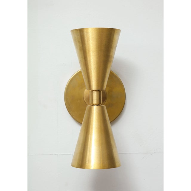 Pair of brass sconces in the midcentury manner. Please view our other listings for this piece in various finishes....
