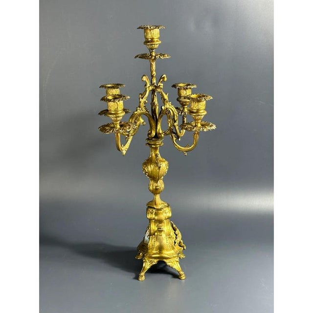 Five-light brass candelabra with hand-painted ceramic elements. Luigi Beccarelli (1837-1908). Italy, 19th century. . The...