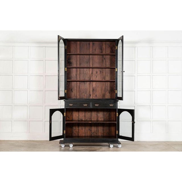 Circa 1880 english 19thc ebonised mahogany glazed bookcase cabinet together w126 x d55.5 x h242 cm base w126 x d55.5 x h98...