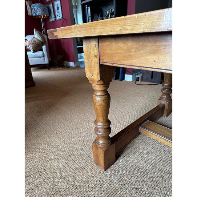 Large sturdy cherry wood dining room table in perfect condition. Nice light color. Not an antique table. Origin: England...