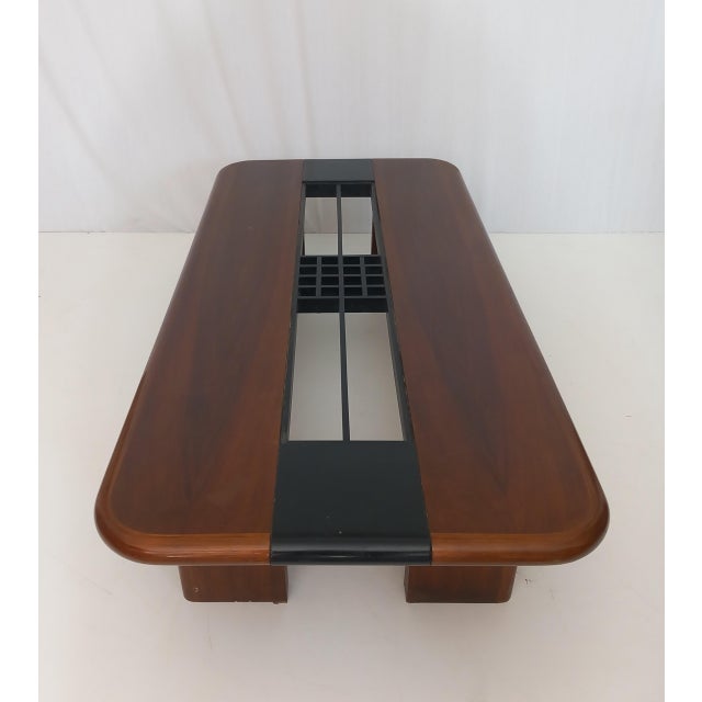 Elevate your living space with this elegant vintage coffee table, designed and produced in the 1980s, featuring a refined...