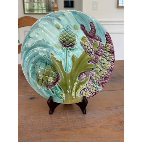 A striking set of six antique French majolica plates by Keller & Guérin, Lunéville — one of the most celebrated faïence...