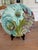 A striking set of six antique French majolica plates by Keller & Guérin, Lunéville — one of the most celebrated faïence...