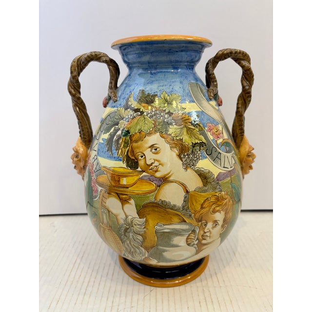This antique vase is a prime example of Italian Renaissance style majolica pottery. hand painted with elaborate...