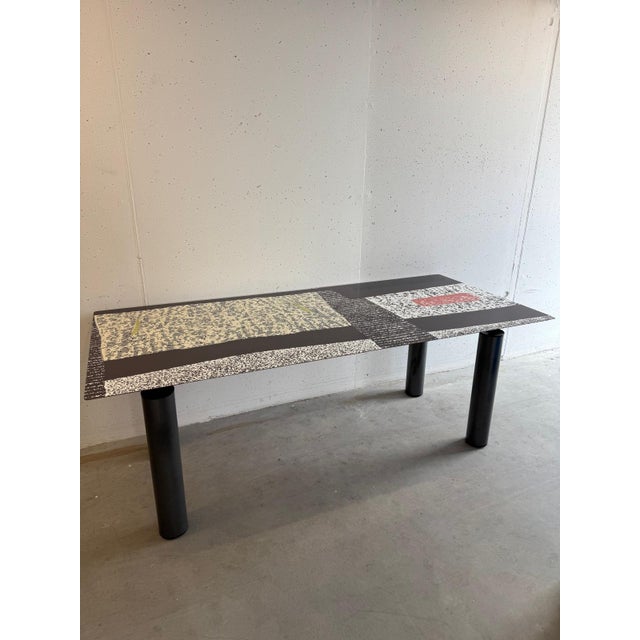Postmodern dining table by the Italian brand De Rosso. The surface features a laminate layer designed by the renowned...