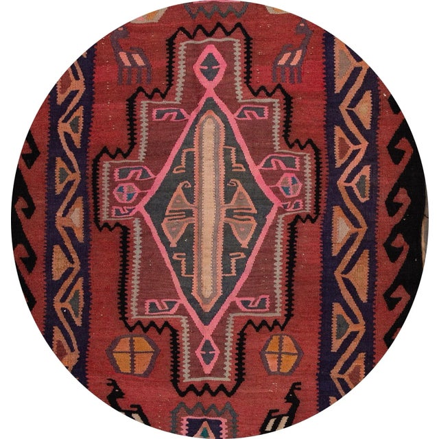 A beautiful hand-woven vintage Kilim runner with a red field, and multi-color accents an all-over geometric design. This...