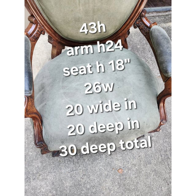 Charming antique Victorian balloon back chair with worn green arm chair.