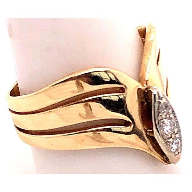 14 Karat Yellow and White Gold Diamond Center Contemporary Ring 0.20 total diamond weight. Size 8.5 7.39 grams total...