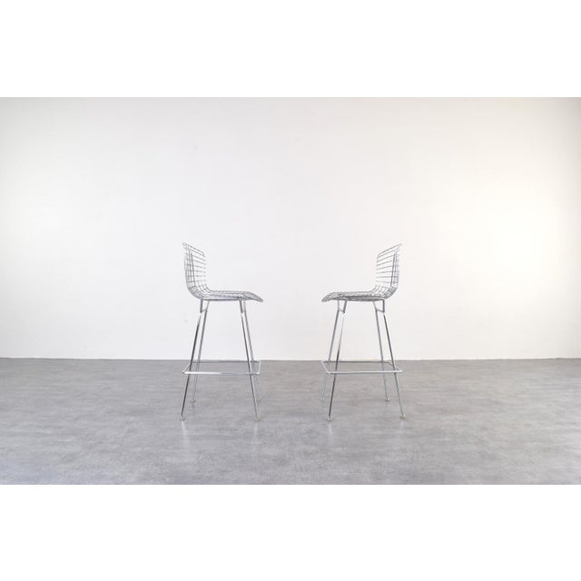 Vintage chromeplating pair of metal wire bar stools designed by Harry Bertoia and manufactured by Knoll International....