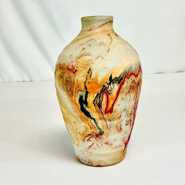 The Nemadji Tile & Pottery Co started in 1929 at Moose Lake, MN. The swirled designed pieces are recognized worldwide-wide...