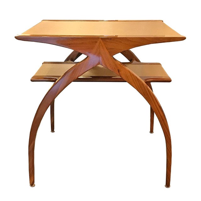 Sinuous Curves and geometry are heralded in this sexy mid century modern side table. Its streamline, exotic fruitwood...